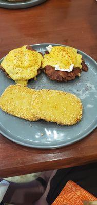 Corned beef eggs Benedict and hash brown patties.