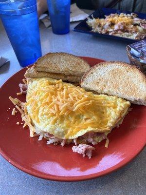 Ham, hashbrowns + cheese omelette w/ toast.