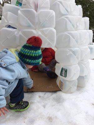 Families collected milk bottles and children together with their teachers upcycled them to create an igloo.