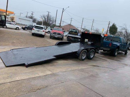 Low ramp trailer for low riding cars .