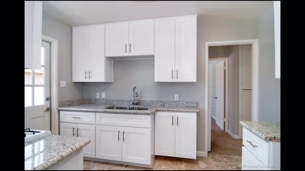 New kitchen- appliances, cabinets, granite, plumbing and travertine floors. March 2015 // National City, CA