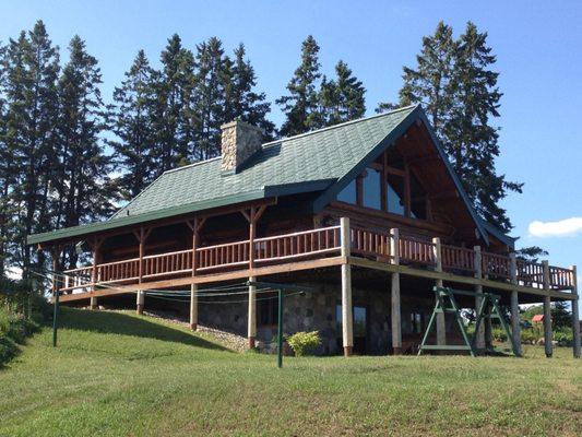 This metal shake roof adds a great deal of detail to this lovely home