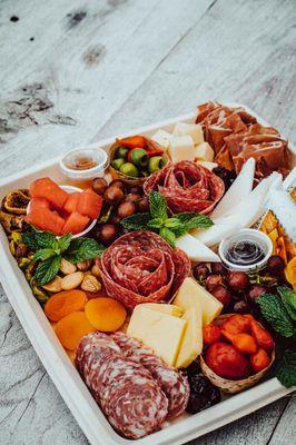 Grab-N-Go Charcuterie: Elevate Your Day on our Picturesque Lawn with an Amazing Selection of Meats and Cheeses.