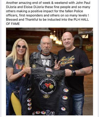 Elouise DEJORIA and John Paul DEJORIA with the PLH Hall of Fame induction vest for Brian