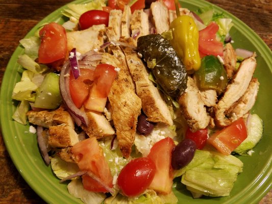 Perfectly made Greek salad with extra tomatoe and grilled chicken.  Come with one pita. Yogurt sauce extra, $1.10. Approx. $15