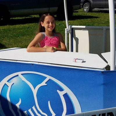 Hannah Gettemy working the Allstate booth