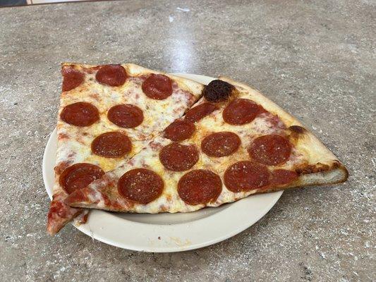 Pizza by the slice with Pepperoni.