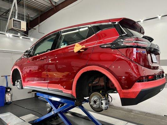 My Chevy Bolt being worked thoroughly, Jeff even took of the tires off my car!