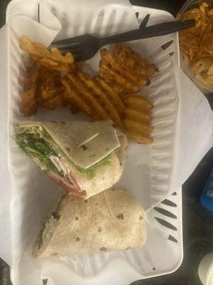 The club wrap and a wrap with chicken, hummus, and veggies. Sides: Mac and cheese and fries