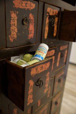 The vintage apothecary cabinet in the front office, holding several of our popular over-the-counter Chinese remedies at the SB Herb Clinic