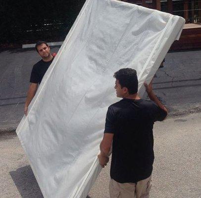 Oversized picture frame wrapped in protective foam sheet. Ready to istall.