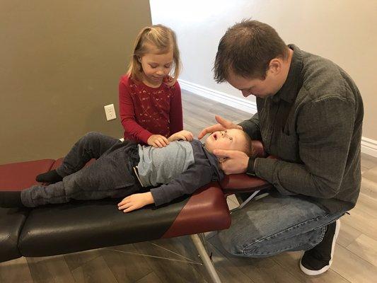 Dr. Randy adjusts kids from newborns to teens