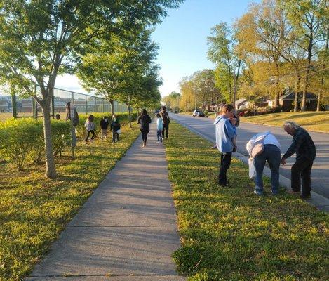 Picking up trash on Rogers Street