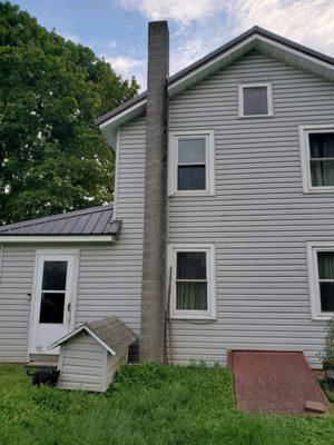 Before picture of chimney deteriorated from terra cotta clay liners. We tore it down and rebuilt it