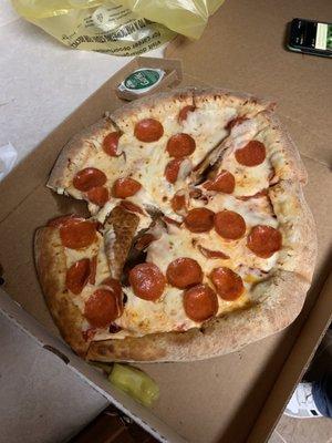 My pizza came cold, lop-sided, and unevenly cut