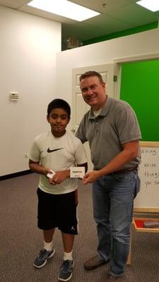 Krish B Patel winning gift card by redeeming his Enopi dollars (with Mr. Freeman)