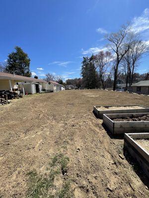 My new beautiful back yard graded freshly loamed and ready for grass! Thank you Bill!