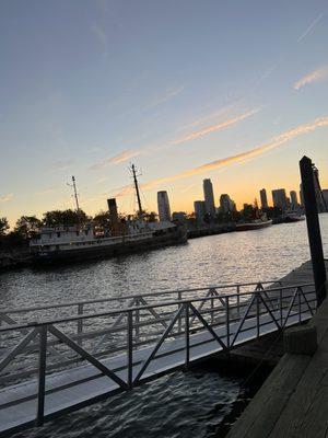 Side view with a tugboat at sunset