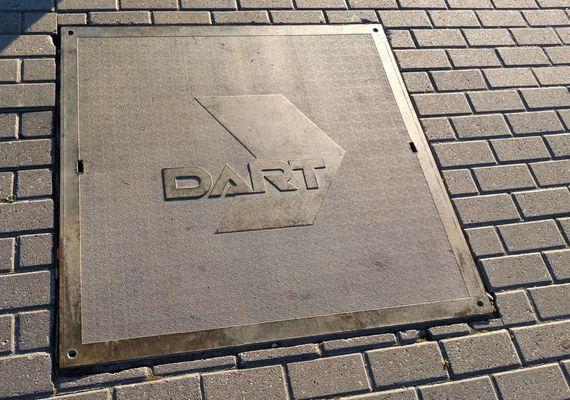 Even a manhole or utility cover has the "action packed" DART logo on it.