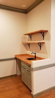 Custom stained butcher block countertop and shelves.