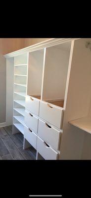 Hand built shelves and drawers in a walk in closet