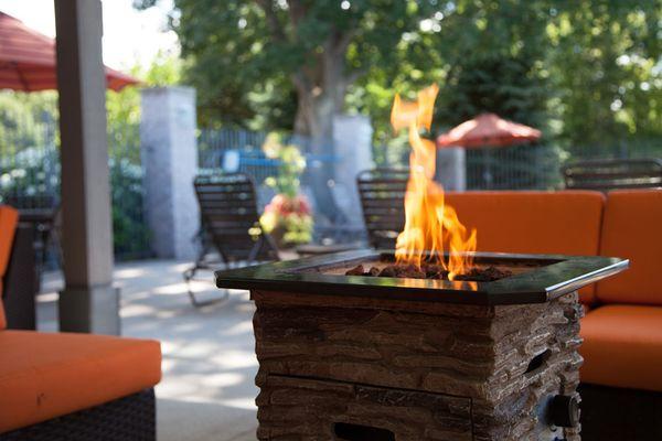 Pool area at Woodland Ridge Apartments with Grilling Station and Fire Pit