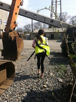 Photographer Lauren Carey films transfer station and rail line.