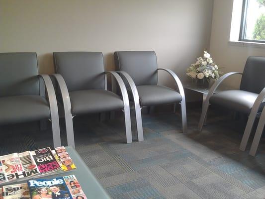 Waiting area with comfy chairs and plenty of magazines.