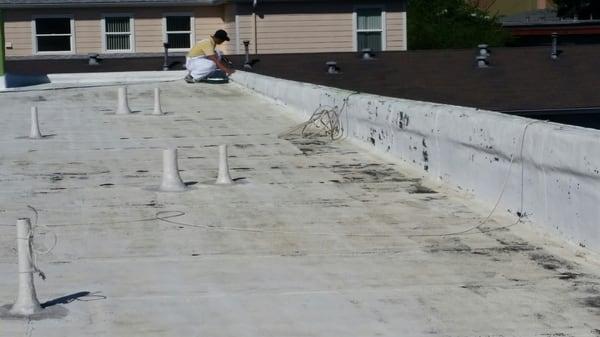 Roof cleaning before coating application