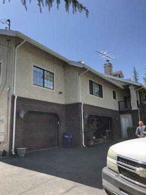 New low gloss white gutters and downspouts