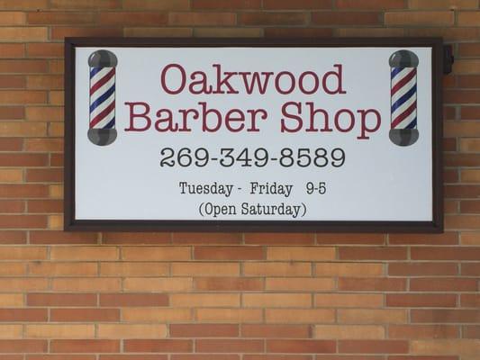 Sign on exterior of barber shop.