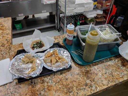 Taco and tamale samples with condiments.