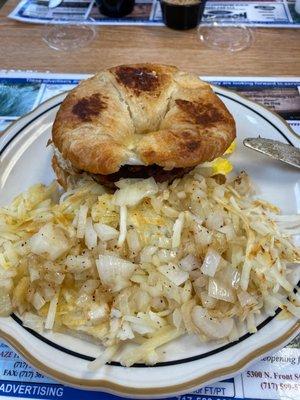 Breakfast sandwich, hash browns and onions