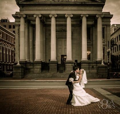 Bride and groom in front of Gallier Hall in New Orleans.