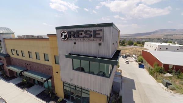 Outside view of RESE Property Management Office and sign.