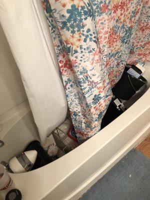 Contractor threw all of our belongings left in our bathroom in our tub and broke several items.