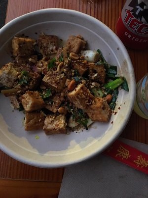 Stir fried tofu w scallions, turmeric oil, crispy garlic, peanuts