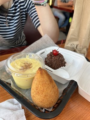 Brazilian Chicken and Cheese Coxinha, corn pudding, and chocolate dessert.