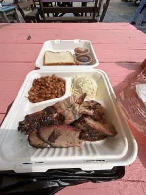 3 meat plate ribs, brisket, pulled pork with 2 sides beans & potato salad reg and spicy  sauce on the side.