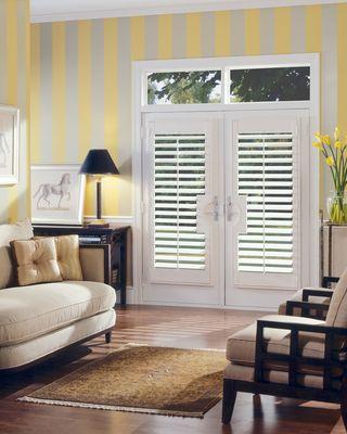 Shutters, wallpaper, and hardwood flooring