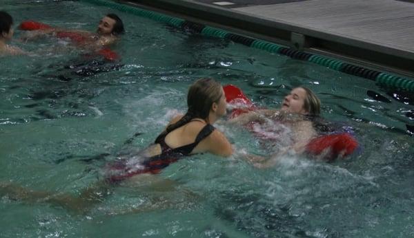 Learning to perform rescues at Carroll ISD Natatorium