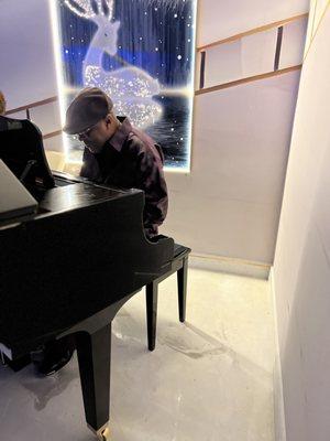 Michael Locket setting the mood inside on the piano for Mother's Day.