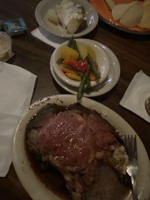 12 ounce prime rib with baked potato and vegetable medley after salad it also came with.