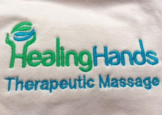 My company logo. They don't charge extra to write the line below, so I can get a name embroidered instead of "Therapeutic Massage".