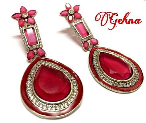 Victorian finish with silver mix metal, ruby colored stones with cubic zirconia.