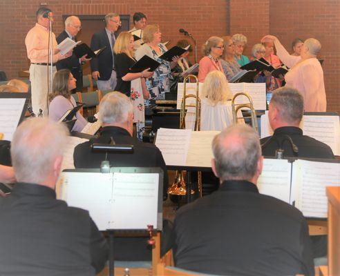 Choir, Brass ensemble, and worship band lead our services