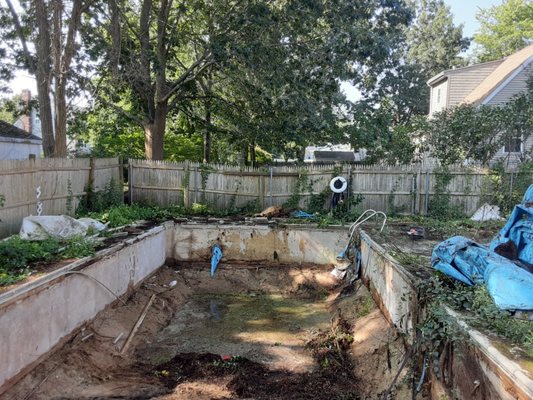 Before pictures of an inground pool fill in