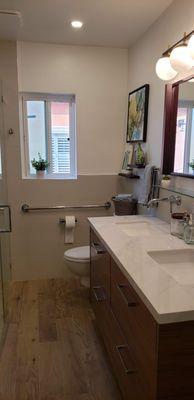 Porcelain counters with large walnut drawers below