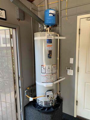 Gas tank water heater installation in garage