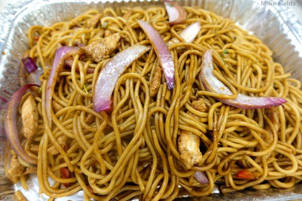 Tallarin Saltado de Pollo - basically chicken lo mein, but with Peruvian spices. HEAPING portion. This was legit a 2 lb. tray.